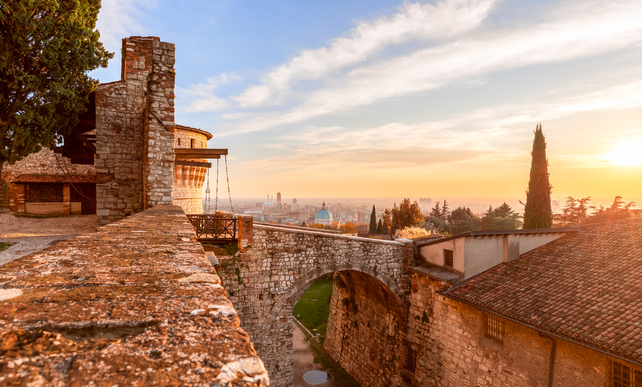 Brescia, Italy - October 28, 2020: Stunning sunset over Brescia city view from the old castle. Lombardy, Italy